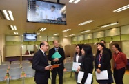 The Secretary for Labour and Welfare, Mr Matthew Cheung Kin-chung (first left), visited the Working Family Allowance Office (WFAO) of the Working Family and Student Financial Assistance Agency in Kwun Tong this morning. Mr Cheung thanked the WFAO's staff for their dedicated work to prepare for the launch of the Low-income Working Family Allowance (LIFA) Scheme next month and their all-out effort in conducting a series of community briefings throughout the territory during all weekends in April to help the public understand the application arrangements.