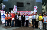 The Secretary for Labour and Welfare, Mr Matthew Cheung Kin-chung (centre); the Under Secretary for Labour and Welfare, Mr Stephen Sui (fourth left); and the Political Assistant to the Secretary for Labour and Welfare, Ms Jade Lai (fifth right); join a signature campaign at a street booth set up by the Alliance for Peace and Democracy in Sheung Wan to support the Government's proposals for selecting the Chief Executive by universal suffrage.