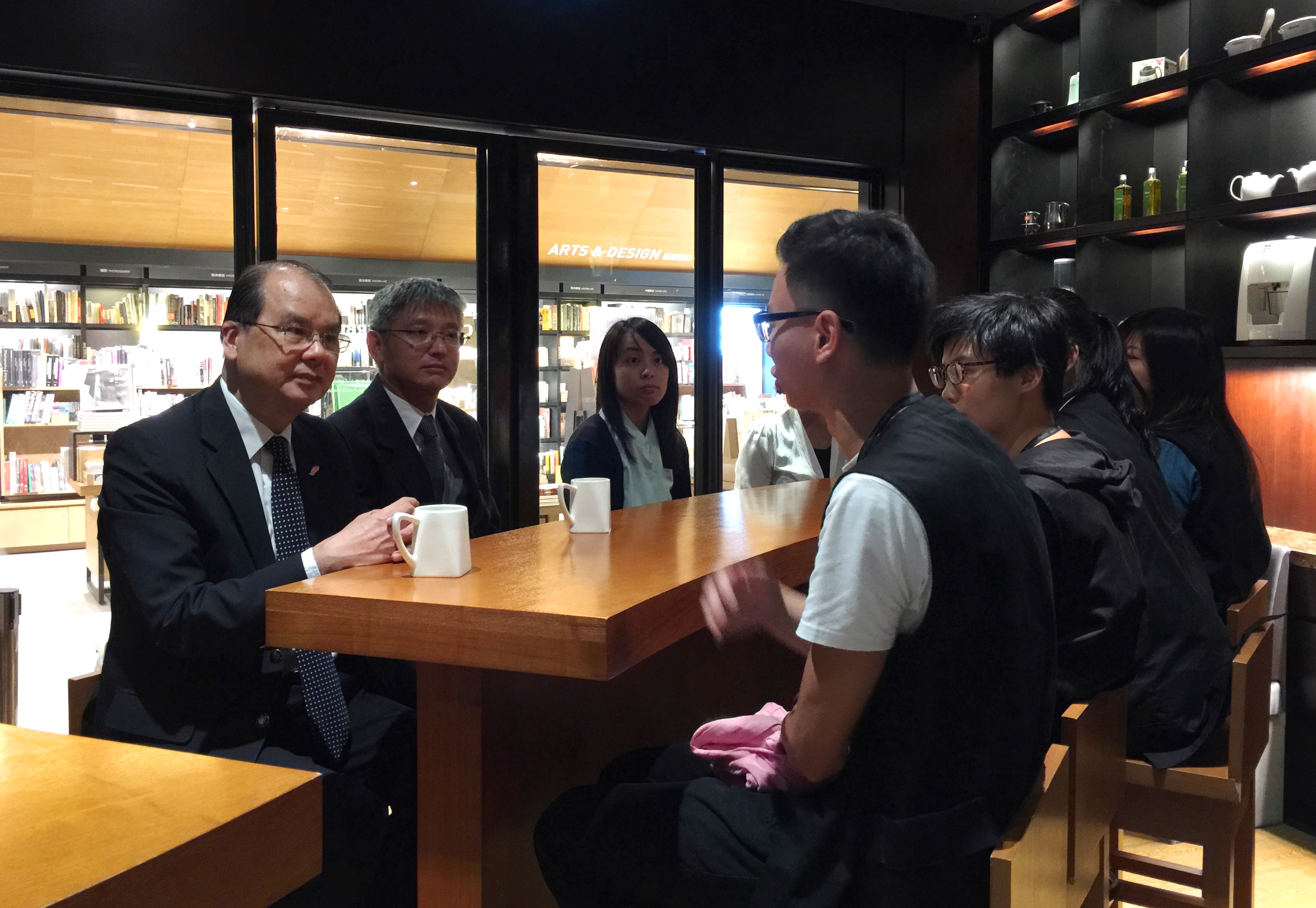 Mr Cheung (first left) chats with the trainees to hear about their career aspirations.