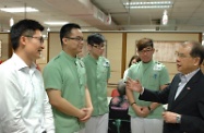 The Secretary for Labour and Welfare, Mr Matthew Cheung Kin-chung, visited young trainees working in two elderly homes. Picture shows Mr Cheung (first right) talking with trainees of the Pilot Project on Multi-skills Workers Training at the Hiu Kwong (To Kwa Wan) Nursing Centre in To Kwa Wan to better understand their daily work. On first left is the Executive Director of Hiu Kwong Nursing Service Limited, Mr Henry Shie.