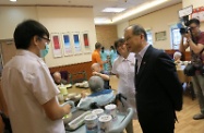 Mr Cheung (front right) chats with a trainee to learn more about his daily work.