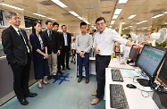 The Secretary for Labour and Welfare, Dr Law Chi-kwong, visited the Social Welfare Department Headquarters  to take a closer look at its work. Photo shows Dr Law (first left) and the Under Secretary for Labour and Welfare, Mr Caspar Tsui (third left), accompanied by the Director of Social Welfare, Ms Carol Yip (second left), being briefed by staff of the Rehabilitation and Medical Social Services Branch on the preparatory work of the regularisation of the Pilot Scheme on On-site Pre-school Rehabilitation Services in the new 2018/19 school year.