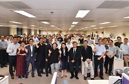 The Secretary for Labour and Welfare, Dr Law Chi-kwong, visited the Social Welfare Department Headquarters  to take a closer look at its work. Photo shows Dr Law (front row, eighth left); the Under Secretary for Labour and Welfare, Mr Caspar Tsui (front row, ninth left); and the Director of Social Welfare, Ms Carol Yip (front row, seventh left), with staff of the Information Systems and Technology Branch.