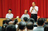 The Secretary for Labour and Welfare, Mr Matthew Cheung Kin-chung (first right) and the Secretary for Education, Mr Eddie Ng (second right) listen to people's views and aspirations at the Yuen Long Merchants Association Primary School.