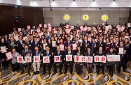 Mr Cheung (front row, sixth right) is pictured with other officiating guests and representatives of corporate awardees.