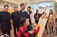 The Secretary for Labour and Welfare, Dr Law Chi-kwong, visited Kwun Tong District to tour the On Tat Neighbourhood Elderly Centre of the Tung Wah Group of Hospitals at On Tat Estate. Photo shows Dr Law (second left) being briefed on the services of the neighbourhood elderly centre.