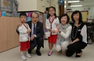 Accompanied by the Chairman of Yan Chai Hospital's Board of Directors, Mrs Susan So (second right), Mr Cheung (second left) visited Yan Chai Hospital Tung Pak Ying Kindergarten/Child Care Centre to learn more about the school's operation and the school life of the newly arrived students, as briefed by the school's principal, Ms Decky Wong (first right).