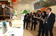 The Secretary for Labour and Welfare, Dr Law Chi-kwong, visited Southern District and called at the TWGHs Jockey Club Rehabilitation Complex in Aberdeen. Photo shows Dr Law (first right) accompanied by the Superintendent of the complex, Ms Fanny Ong (second right), visiting an exhibition of artworks by mentally handicapped persons in i-dArt.