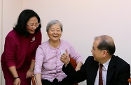 Mr Cheung (second right) joins some elderly service users in a game that trains their coordination skills.
