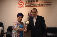 Mr Cheung is pictured with Ms Corazon Juliano Soliman.