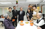 Mr Cheung (centre) visits the SAGE Eastern District Elderly Community Centre.