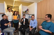 The Secretary for Labour and Welfare, Dr Law Chi-kwong, visited Yau Tsim Mong District and called at the SOUK housing unit of the Society of Rehabilitation and Crime Prevention, Hong Kong (SRACP) in Yau Ma Tei. Photo shows (front row, from left) the Chairman of Yau Tsim Mong District Council, Mr Chris Ip; Dr Law; and the Chief Executive of the SRACP, Mr Andy Ng, chatting with a tenant who is an ex-offender.