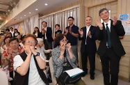 The Secretary for Labour and Welfare, Dr Law Chi-kwong, visited Yau Tsim Mong District and called at the Mong Kok Kai Fong Association Chan Hing Social Service Centre. Photo shows (back row, from right) Dr Law; the Chairman of Mong Kok Kai Fong Association, Mr Leung Wah-sing; the Chairman of Yau Tsim Mong District Council, Mr Chris Ip; the District Officer (Yau Tsim Mong), Mrs Laura Aron; and the Under Secretary for Labour and Welfare, Mr Caspar Tsui, watching seniors attending a harmonica class.