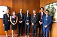 The Secretary for Labour and Welfare, Dr Law Chi-kwong, met with the System Initiative Management Team of the World Economic Forum (WEF) on how to prepare for the advent of the artificial intelligence era this morning (June 18, Geneva time) amid meetings of the Centenary Conference of the International Labour Organization in Geneva, Switzerland. Photo shows Dr Law (third right) and the Director of the Hong Kong Economic and Trade Office, Berlin, Mr Bill Li (first right), with the Head of the Centre for the New Economy and Society of the WEF, Ms Saadia Zahidi (centre), and her team members.