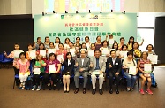 Mr Cheung (fifth right, front row) is pictured with Professor Wong (fourth right, front row), the Head of OUHK's Division of Nursing and Health Studies, Professor Joseph Lee (third right, front row), volunteers trained by OUHK and other participating guests.