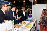 The Labour Department is holding a large-scale job expo for elderly and rehabilitation services at MacPherson Stadium in Mong Kok (July 18 and 19). Photo shows the Secretary for Labour and Welfare, Dr Law Chi-kwong (fourth left), chatting with an Employment Services Ambassador for Ethnic Minorities employed by the Labour Department to learn more about her daily work.