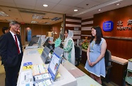 The Secretary for Labour and Welfare, Dr Law Chi-kwong, visited North Point Job Centre of the Labour Department. Photo shows Dr Law (left) chatting with staff to learn more about employment and recruitment services for job seekers and employers. The centre arranges for an Employment Services Ambassador for Ethnic Minorities (centre) to assist job seekers from ethnic minorities in using the centre's services.