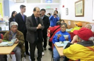 Mr Cheung (centre) visits the Po Leung Kuk Lau Chan Siu Po District Elderly Community Centre to show his care for the elderly.