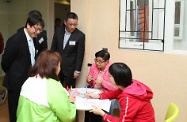 The Secretary for Labour and Welfare, Mr Stephen Sui, attended the opening ceremony of Hong Chi Jockey Club Pinehill Hostel of Hong Chi Association. Photo shows Mr Sui (fisrt left) interacting with service users.