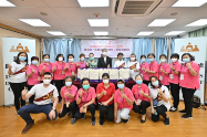 The Secretary for Labour and Welfare, Dr Law Chi-kwong, today (June 20) visited Wan Chai District and Islands District, and distributed gift packs under the Celebrations for All project in celebration of the 25th anniversary of the establishment of the Hong Kong Special Administrative Region, extending warm regards to the disadvantaged and the underprivileged. Photo shows (back row, from seventh left) the District Officer (Islands), Miss Amy Yeung; Dr Law; and the Chairman of the OIWA, Ms Chau Chuen-heung, with volunteers at the launch ceremony in Islands District.