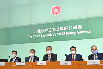 The Financial Secretary, Mr Paul Chan (centre), elaborates on the attracting enterprises and talent initiatives in the 'Chief Executive’s 2022 Policy Address' at a press conference today (October 20). Looking on are the Deputy Chief Secretary for Administration, Mr Cheuk Wing-hing (second left); the Secretary for Constitutional and Mainland Affairs, Mr Erick Tsang Kwok-wai (first right); the Secretary for Commerce and Economic Development, Mr Algernon Yau (second right); and the Secretary for Labour and Welfare, Mr Chris Sun (first left).