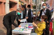 The Secretary for Labour and Welfare, Dr Law Chi-kwong; Under Secretary for Labour and Welfare, Mr Ho Kai-ming; and Political Assistant to Secretary for Labour and Welfare, Mr Henry Fung, signed at a street counter on Tai Shing Street in Wong Tai Sin this afternoon (March 12) in support of improving the electoral system of the Hong Kong Special Administrative Region and the implementation of the principle of "patriots administering Hong Kong ".