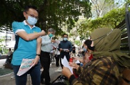 The Secretary for the Civil Service, Mr Patrick Nip (first left); the Secretary for Labour and Welfare, Dr Law Chi-kwong (second left); and the Consul General of the Republic of Indonesia in Hong Kong, Mr Ricky Suhendar (third left) distribute leaflets at Victoria Park today (August 1) to encourage Indonesian community in Hong Kong to get vaccinated against COVID-19.