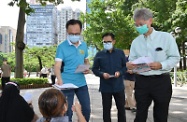The Secretary for the Civil Service, Mr Patrick Nip (third right); the Secretary for Labour and Welfare, Dr Law Chi-kwong (first right); and the Consul General of the Republic of Indonesia in Hong Kong, Mr Ricky Suhendar (second right) distribute leaflets at Victoria Park today (August 1) to encourage Indonesian community in Hong Kong to get vaccinated against COVID-19.