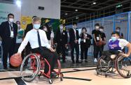 The Secretary for Labour and Welfare, Dr Law Chi-kwong, today (November 3) officiated at the opening ceremony of the Gerontech and Innovation Expo cum Summit 2021 jointly hosted by the Government and the Hong Kong Council of Social Service. Photo shows Dr Law (left) in a wheelchair basketball game with a representative of the Hong Kong Federation of Handicapped Youth at the Interactive Sports Ground.