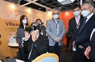 The Secretary for Labour and Welfare, Dr Law Chi-kwong, today (November 3) officiated at the opening ceremony of the Gerontech and Innovation Expo cum Summit 2021 jointly hosted by the Government and the Hong Kong Council of Social Service. Photo shows Dr Law (first left) in a virtual reality experiential programme to understand more about persons in recovery at the booth of the New Life Psychiatric Rehabilitation Association.