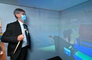 The Secretary for Labour and Welfare, Dr Law Chi-kwong, today (November 3) officiated at the opening ceremony of the Gerontech and Innovation Expo cum Summit 2021 jointly hosted by the Government and the Hong Kong Council of Social Service. Photo shows Dr Law in a virtual reality dragon boat simulation.