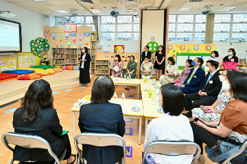 The Secretary for Labour and Welfare, Mr Chris Sun; the Permanent Secretary for Labour and Welfare, Ms Alice Lau; and the Director of Social Welfare, Miss Charmaine Lee, visited Po Leung Kuk Wai Yin Kindergarten-Cum-Nursery this morning (August 23) to learn more about the effectiveness and implementation of the On-site Pre-school Rehabilitation Services (OPRS). Photo shows Mr Sun (rear, third right) being briefed by staff on the OPRS of the school.
