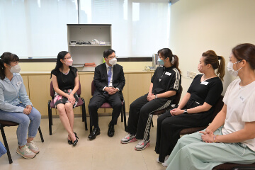 The Secretary for Labour and Welfare, Mr Chris Sun, visited the Practical Skills Training and Assessment Centre of the Employees Retraining Board on August 24 to take a closer look at its practical assessments for various courses. The Permanent Secretary for Labour and Welfare, Ms Alice Lau, also joined the visit. Photo shows Mr Sun (third left) and Ms Lau (second left) chatting with healthcare graduate trainees to understand their experience in serving residential care homes and day care centres as well as welfare and healthcare organisations.