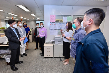 The Secretary for Labour and Welfare, Mr Chris Sun, visited service units of Sha Tin District of the Social Welfare Department this afternoon (August 31) to keep abreast of the latest developments of frontline services. The Under Secretary for Labour and Welfare, Mr Ho Kai-ming, also joined the visit. Photo shows Mr Sun (first left) and Mr Ho (second left) being updated by officers of the Sha Tin (South) Social Security Field Unit on the preparatory work prior to the merger of the Normal and Higher Old Age Living Allowance to be implemented tomorrow (September 1).