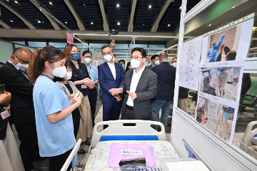 The Secretary for Labour and Welfare, Mr Chris Sun, today (September 1) visited the Kai Tak Quarantine Centre at the Kai Tak Cruise Terminal to learn more about the preparatory work prior to its commencement of operation tomorrow (September 2). Photo shows Mr Sun (front row, first right) being updated by a staff member of the care team on the care services to the elderly during their stay.
