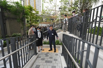 The Deputy Director General of the Rights Protection Department of the China Disabled Persons' Federation (CDPF), Mr Zhang Dongwang, led a delegation comprising representatives from the Legislative Affairs Commission and the Social Development Affairs Committee of the National People's Congress and the CDPF in its visit on the development of barrier-free environment in Hong Kong in the past three days (April 17 to 19), as part of its visit to Hong Kong and Macao. The delegation visited Queen's Hill Estate in Fanling, which completed intake, on April 17 afternoon. Photo shows Mr Zhang (front row, right) on a ramp for wheelchair users.