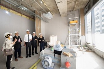 The Deputy Financial Secretary, Mr Michael Wong, and the Secretary for Labour and Welfare, Mr Chris Sun, today (November 3) observed the renovation works of the first Community Living Room at Fuk Wa Street of Sham Shui Po. The Policy Address set out the Pilot Programme on Community Living Room (CLR) to be launched later this year. The business sector will provide venues and the Community Care Fund will provide the funding to commission non-governmental organisations to operate. The CLRs will offer shared kitchens and dining rooms, as well as common spaces for doing homework, holding interest classes and group activities, providing subdivided unit households with additional living space in their respective communities.