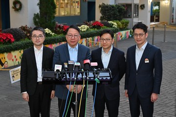 The Chief Secretary for Administration, Mr Chan Kwok-ki (second left), together with the Secretary for Labour and Welfare, Mr Chris Sun (second right); and the Acting Secretary for Education, Mr Sze Chun-fai (first left), meets the media after visiting a primary school under the School-based After School Care Service Scheme today (December 7).