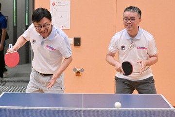 The Secretary for Labour and Welfare, Mr Chris Sun, and the Acting Secretary for Education, Dr Sze Chun-fai, joined the public for sports and recreation programmes at Choi Wing Road Sports Centre in Kwun Tong this afternoon (August 2) as part of the Sport For All Day 2026 organised by the Leisure and Cultural Services Department. Photo shows Mr Sun (left) and Dr Sze (right), taking part in table tennis participation activities.