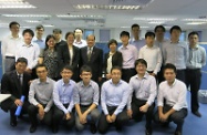Mr Cheung (second row, fourth left) is pictured with staff of the Working Family Allowance Office who are responsible for the development and installation of the Office's information technology infrastructure.