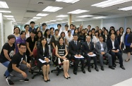 Mr Cheung (third right, front row) is pictured with Mr Esmond Lee (fourth right, front row); the Senior Principal Executive Officer (Special Assignment) of the Labour and Welfare Bureau, Ms Winnie Lau (fifth right, front row); the Principal Executive Officer (Working Family Allowance Office), Ms Teresa Cheung (sixth right, front row) and staff of the Office who are responsible for administrative work and setting out the operational details of the Low-income Working Family Allowance Scheme. Second right, front row is the Under Secretary for Labour and Welfare, Mr Stephen Sui.