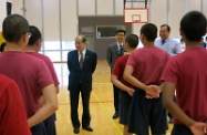 Mr Cheung (first left) chats with residents of the Tuen Mun Children and Juvenile Home to learn about their daily life.