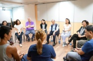 The Secretary for Labour and Welfare, Mr Matthew Cheung Kin-chung (third right), and the Director of Social Welfare, Ms Carol Yip (fourth left), visited the headquarters of Youth Outreach (YO) in Sai Wan Ho last night. Photo shows Mr Cheung being briefed on the various services provided by YO to help vulnerable young people return to the right track. Accompanying him are the YO's President, Ms Au King-chi (second right), Executive Committee Member Ms Leonie Ki (first right) , and the Executive Director, Dr Peter Newbery (third left).