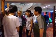 Mr Cheung (third right) and Ms Yip (second right) tour the residential facilities in YO's headquarters.