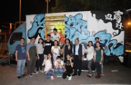 Mr Cheung joins YO's outreach social workers in the early hours of this morning to approach young night drifters in Tin Shui Wai to understand more about their background and needs. Photo shows Mr Cheung (third right) taking a group photo with the outreaching team and service users in front of YO's Street Rover.