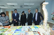 The Secretary for Labour and Welfare, Dr Law Chi-kwong, visited Fanling Occupational Health Clinic (OHC) of the Labour Department. Photo shows Dr Law (second right); the Permanent Secretary for Labour and Welfare, Ms Chang King-yiu (first left); and the Commissioner for Labour, Mr Carlson Chan (first right), being briefed on the services of OHCs.