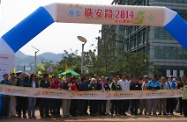 Mr Cheung (centre) officiates at the start of the charity walk with other officiating guests.