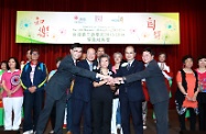 Mr Cheung (second right, front row), Professor Alfred Chan (first right, front row), Mr Wan Chi-tin (second left, front row), and Mr Chua Hoi-wai (first left, front row) are pictured with students who participated in a drama performance at the ceremony.