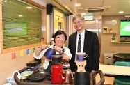 The Secretary for Labour and Welfare, Dr Law Chi-kwong, visited Islands District and toured the Neighbourhood Advice-Action Council Tung Chung Integrated Services Centre. Photo shows Dr Law (right) with a volunteer preparing coffee.