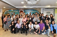 The Secretary for Labour and Welfare, Dr Law Chi-kwong, visited Islands District and toured the Neighbourhood Advice-Action Council Tung Chung Integrated Services Centre. Photo shows Dr Law (last row, fifth left) and the Under Secretary for Labour and Welfare, Mr Caspar Tsui (last row, sixth left), with elderly persons, volunteers and staff of the centre.